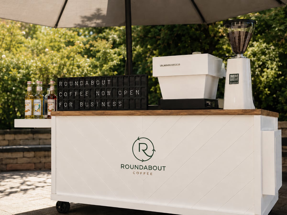 Roundabout Coffee cart with espresso equipment and branded front panel
