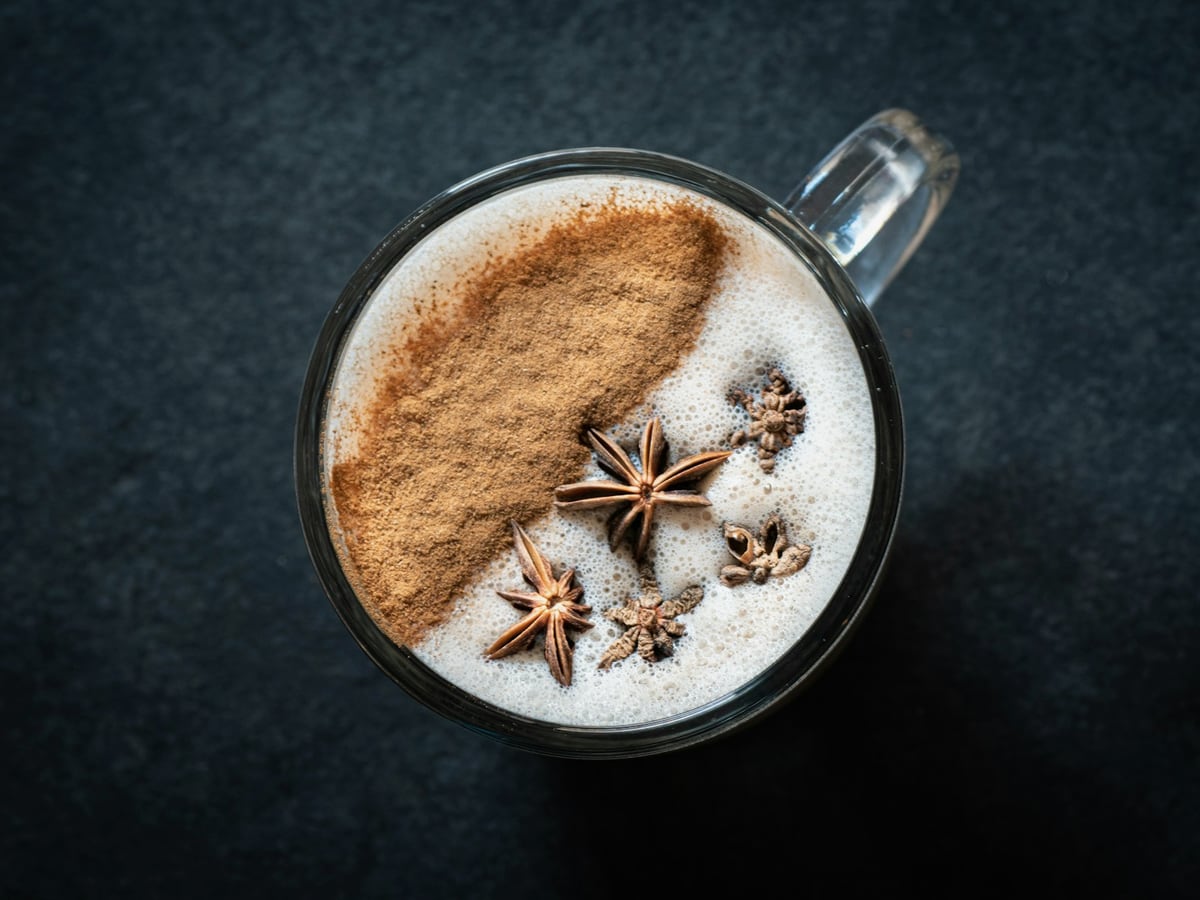 Warm spiced chai in a glass mug