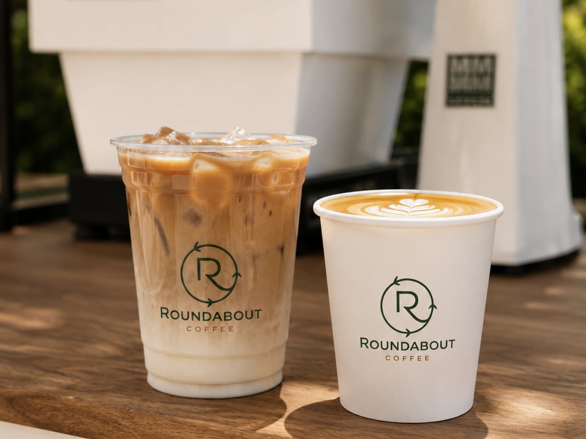 Roundabout Coffee branded iced latte and hot coffee cup